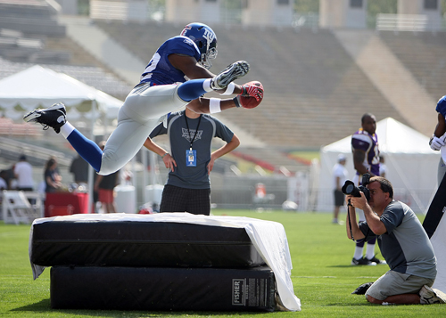 Shonn Greene (Jets) being shot by John Grieshop at the Porta-Pit