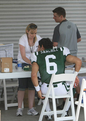 Mark Sanchez (Jets) getting ready to sign his UDC memorabilia