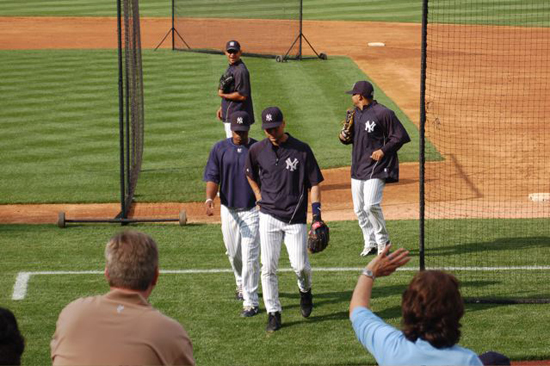 Jeter coming in from shagging flies in the outfield.