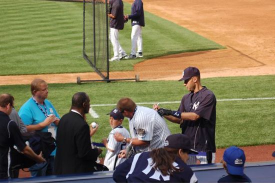 Jeter signs Josh Adams’s Yankee jersey on the No. 2.