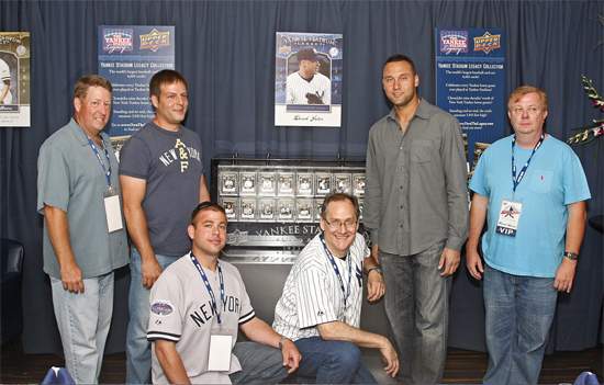 The five winners from Upper Deck’s Yankee Stadium Legacy Collection contest pose with Yankees Team Captain Derek Jeter alongside the YSL card collection that was on display at the NYY Steak restaurant in New York on June 16. From left: Kent Hayes, Tommy Baxter, Josh Adams, Leo Wiznitzer, Jeter and Chuck Sauter.