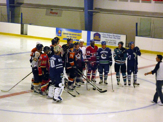 On-Ice Station: All 14 of the participating rookies listen for instruction at Station No. 1.