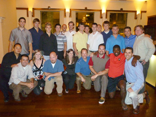 Upper Deck staffers pose with the NHL Rookies following the day’s events.