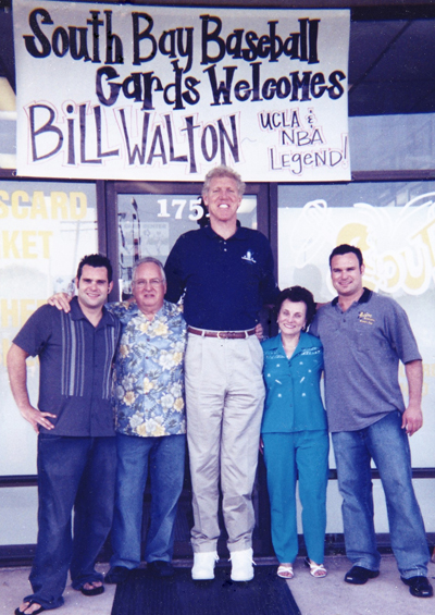 From left to right: Brett Allen, Ian Allen, Bill Walton, Sharilyn Allen and Scott Allen in front of the shop for an Upper Deck sponsored signing.