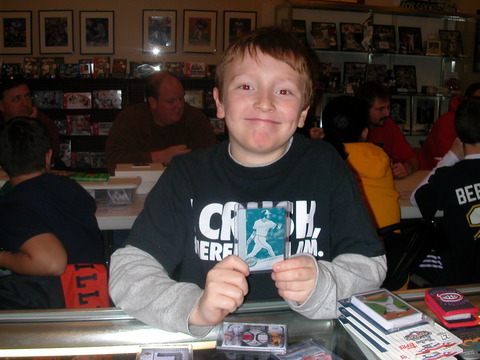 One of the younger collectors at Fox Sports Cards showing off a Eddie Murray one-of-one printing plate cards he won at a trade night.