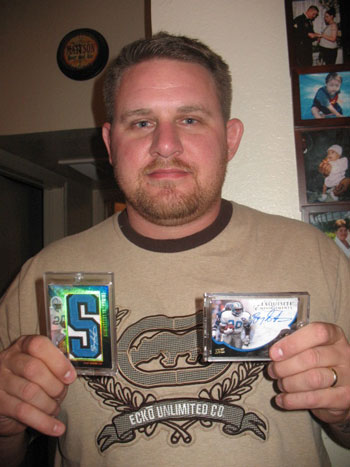 Josh showing off two of his favorite Upper Deck Barry Sanders autograph cards.