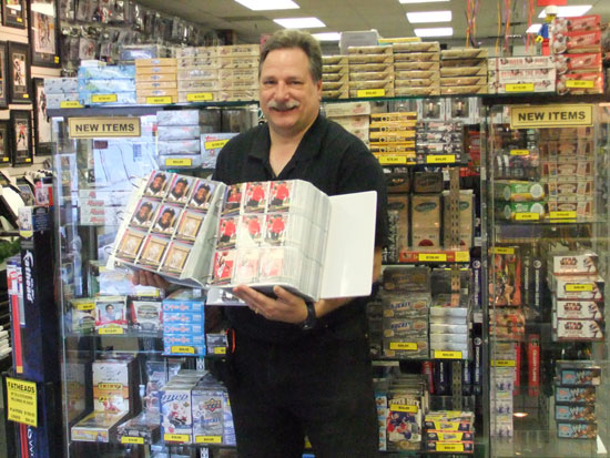 Paul Boleska holding one of the binders of his enormous 20th Anniversary Set.