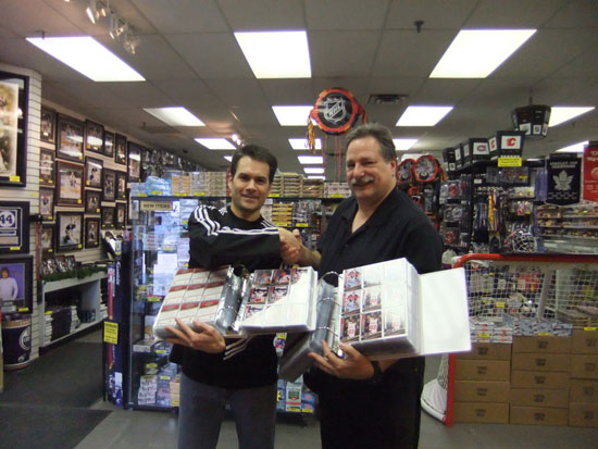 Wayne Wagner of Wayne’s Sportscards congratulates Boleska on putting together the entire 20th Anniversary set.