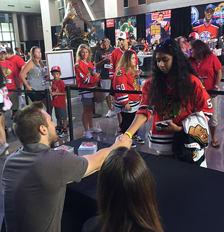 2017-nhl-draft-upper-deck-booth-autograph-session-tyler-motte-chicago-blackhawks-trade-panarin-columbus-shake-hands